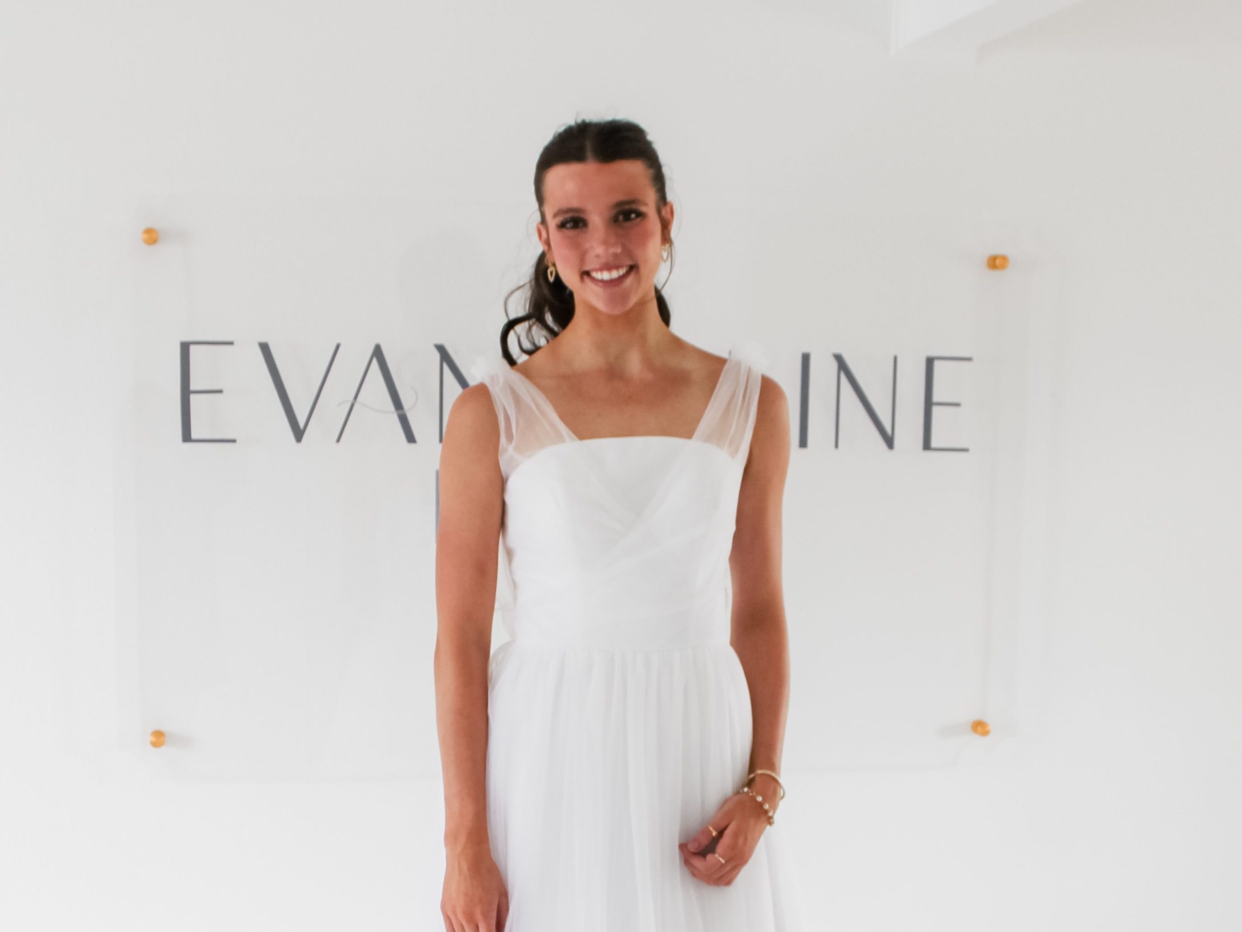 model wearing a National Charity League sample dress at Evangeline Bridal